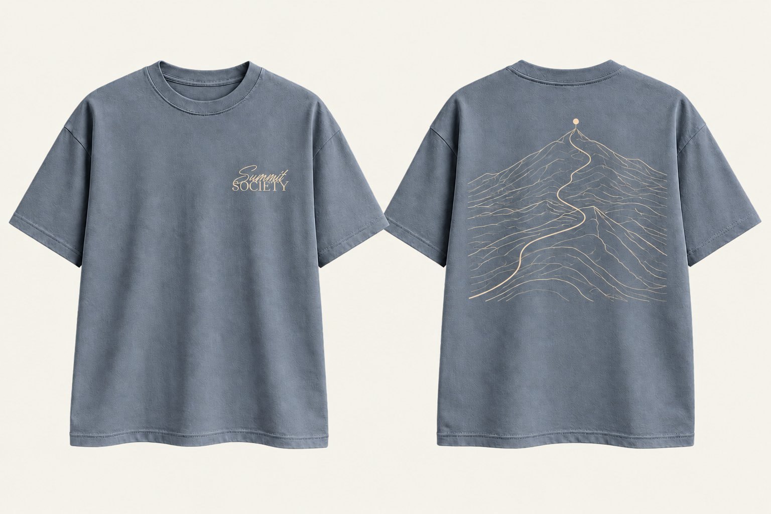 Playera azul gris Volcanic Line con logo al frente y perfil volcánico en la espalda